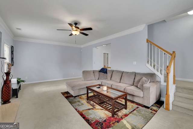 carpeted living room with ornamental molding and ceiling fan