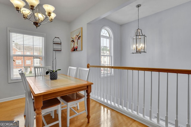 dining area featuring a chandelier and a healthy amount of sunlight