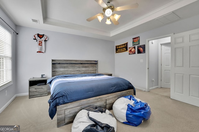 bedroom featuring multiple windows, light carpet, and ceiling fan