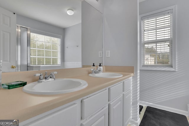 bathroom featuring vanity and plenty of natural light