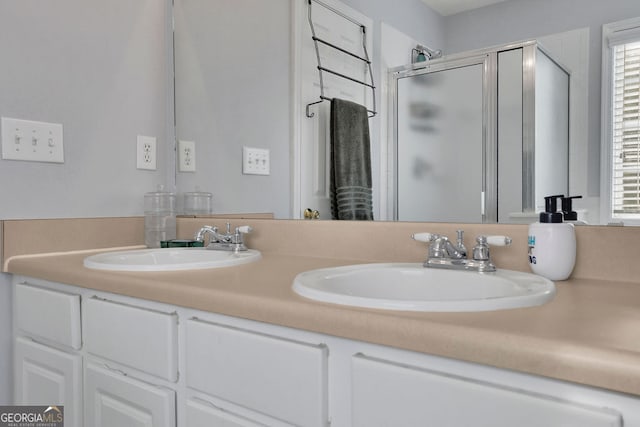 bathroom with walk in shower and vanity