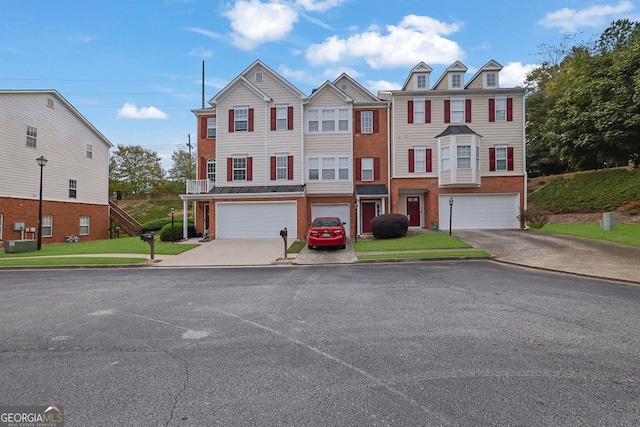 multi unit property featuring a garage