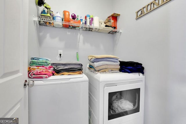 laundry room with washer and dryer