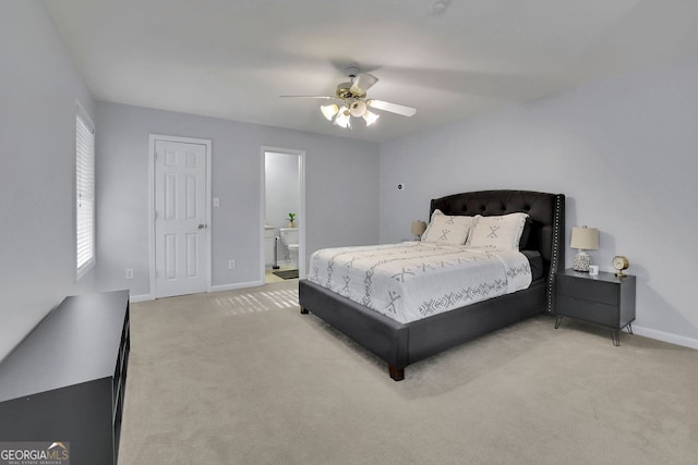 bedroom featuring carpet flooring, ceiling fan, and ensuite bathroom