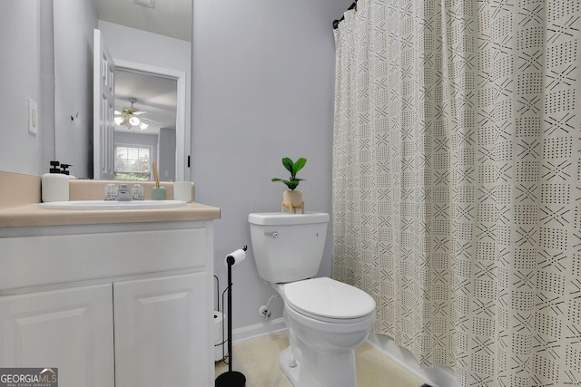 bathroom featuring ceiling fan, vanity, tile patterned floors, walk in shower, and toilet