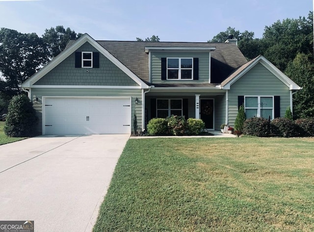 craftsman-style home with a garage and a front lawn