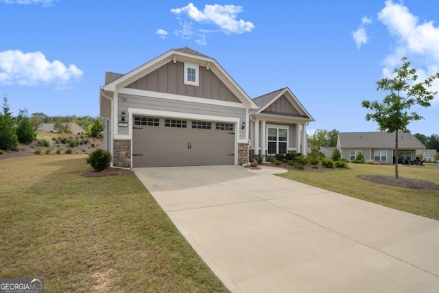 craftsman inspired home featuring a front lawn and a garage