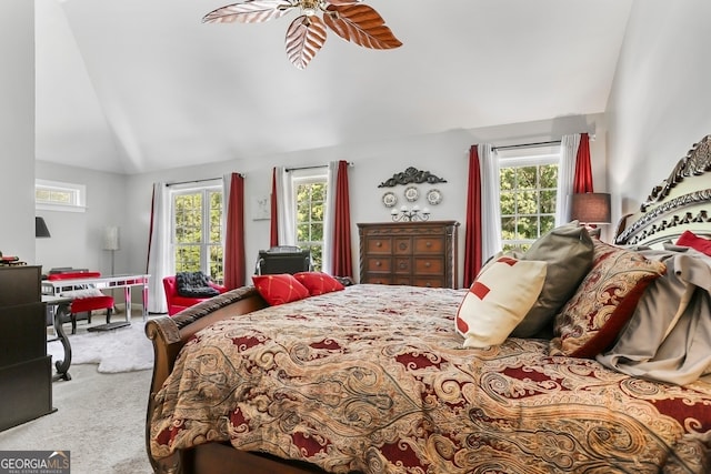 bedroom with ceiling fan, carpet floors, lofted ceiling, and multiple windows