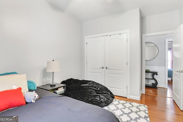 bedroom featuring a closet and wood-type flooring