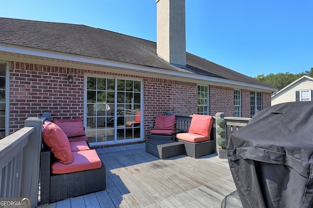 wooden terrace featuring area for grilling