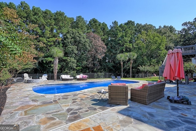 view of swimming pool with a patio