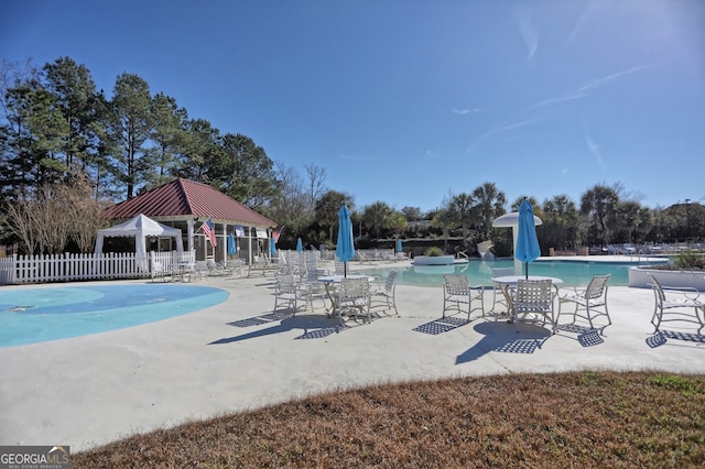 view of swimming pool with a patio