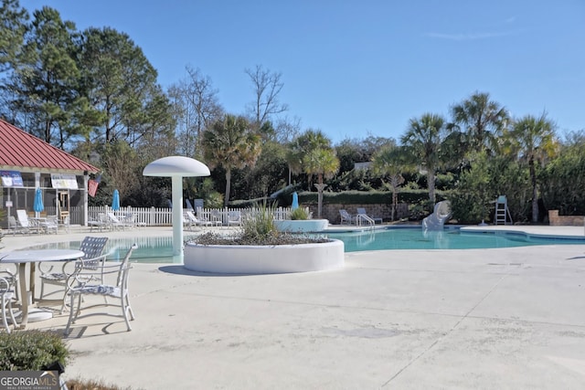 view of swimming pool with a patio