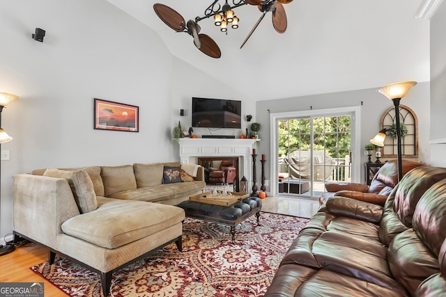 living room featuring high vaulted ceiling, hardwood / wood-style floors, and ceiling fan