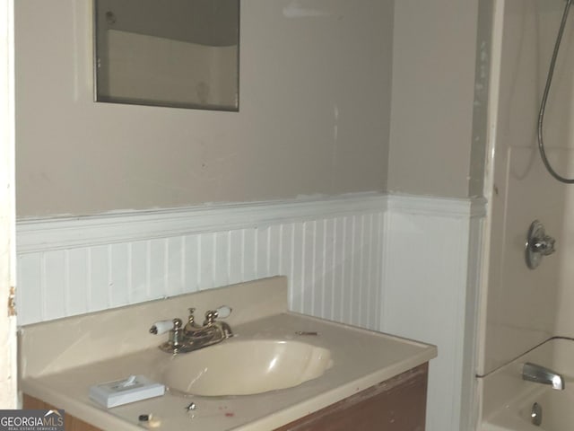 bathroom featuring vanity and washtub / shower combination