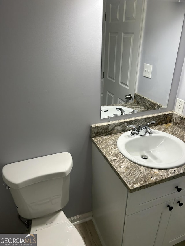 bathroom with vanity and toilet