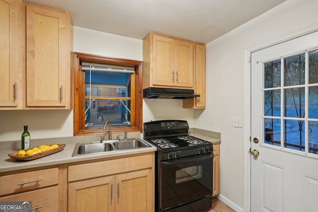 kitchen with black gas stove, sink, and light brown cabinets