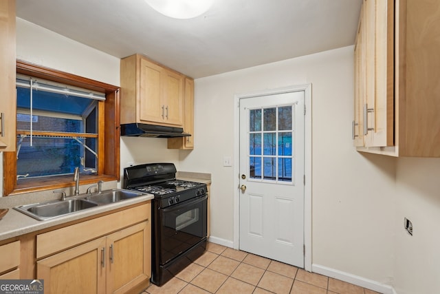 kitchen featuring light brown cabinetry, light tile patterned floors, sink, and black gas range oven