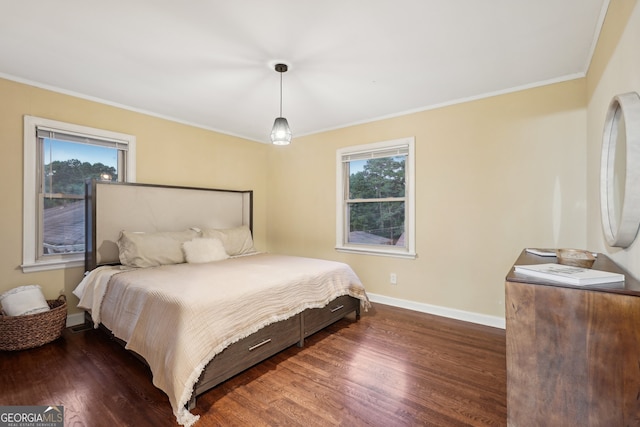 bedroom featuring crown molding and dark hardwood / wood-style flooring