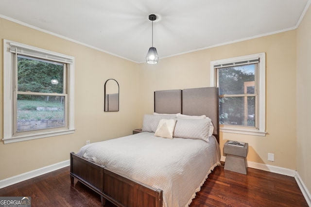 bedroom featuring dark hardwood / wood-style floors and crown molding