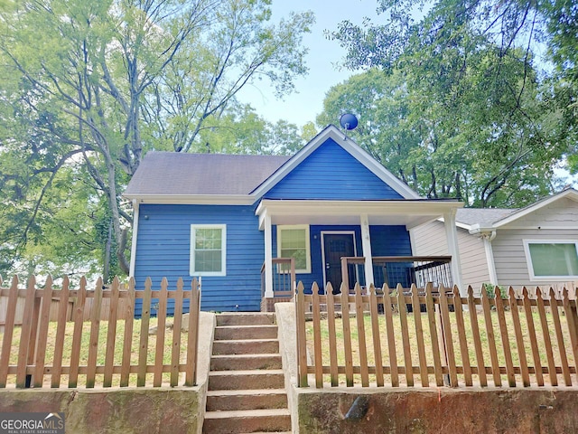 view of front of house with a front lawn and a porch