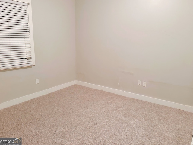 unfurnished room with carpet floors