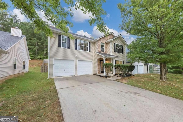 view of front of house featuring a front lawn and a garage