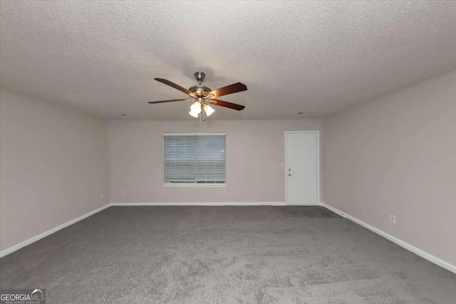 carpeted empty room with ceiling fan and a textured ceiling