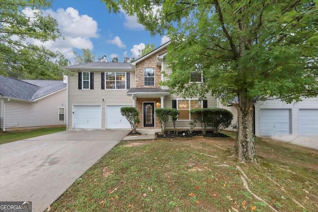 view of front facade with a garage and a front yard