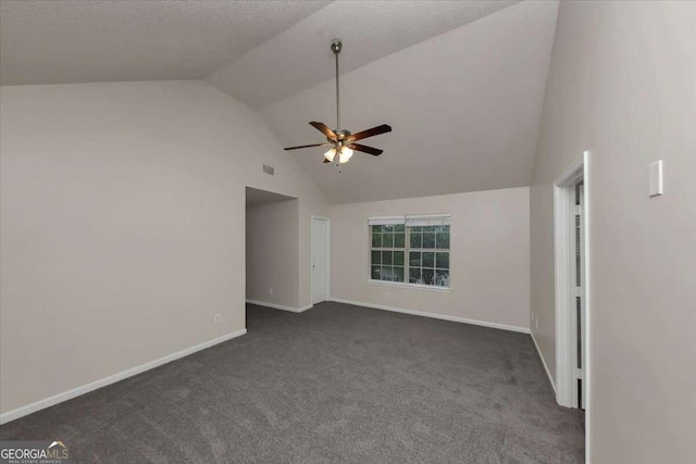 interior space with ceiling fan, dark carpet, and high vaulted ceiling