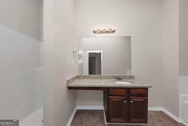 bathroom featuring vanity and a bathtub