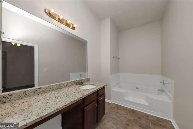 bathroom with vanity and a bathtub