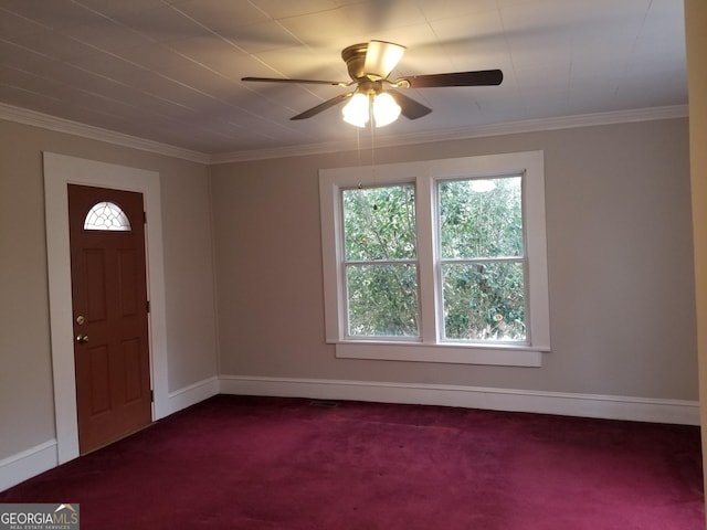 foyer entrance with carpet, ceiling fan, and crown molding