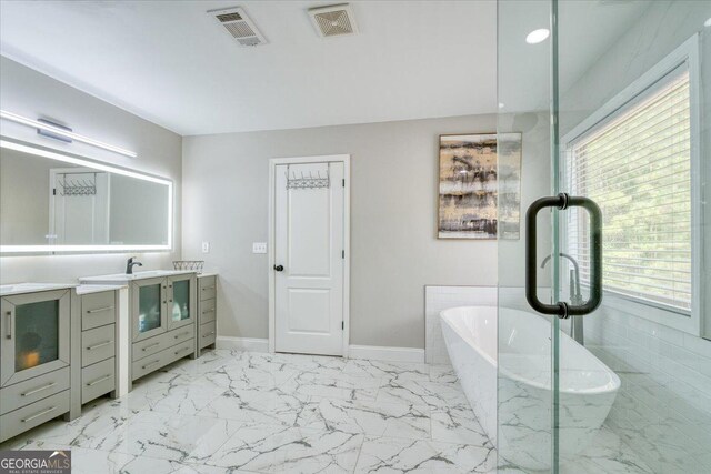 bathroom featuring a bathing tub and vanity