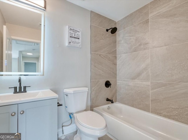 full bathroom featuring tiled shower / bath combo, vanity, and toilet