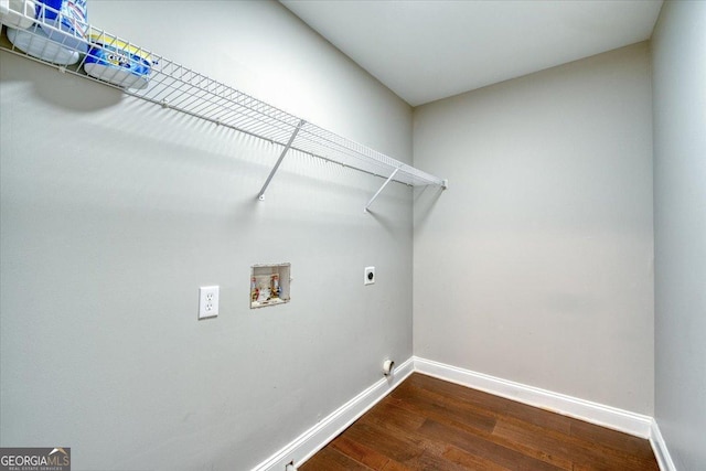 clothes washing area with electric dryer hookup, hookup for a washing machine, and dark wood-type flooring