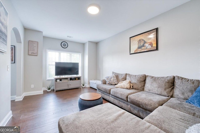 living room with dark wood-type flooring