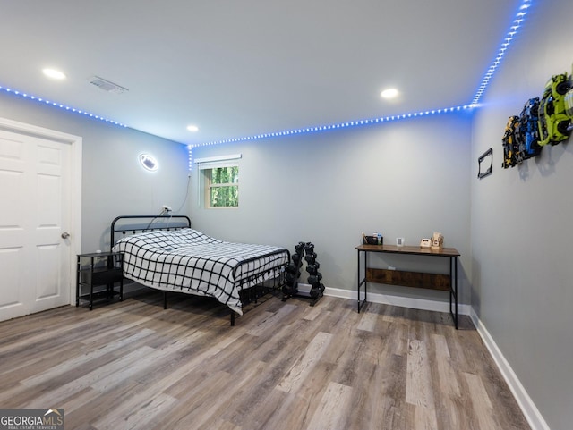 bedroom with light hardwood / wood-style floors