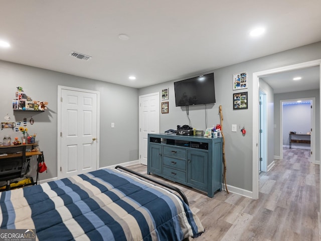 bedroom with light hardwood / wood-style flooring