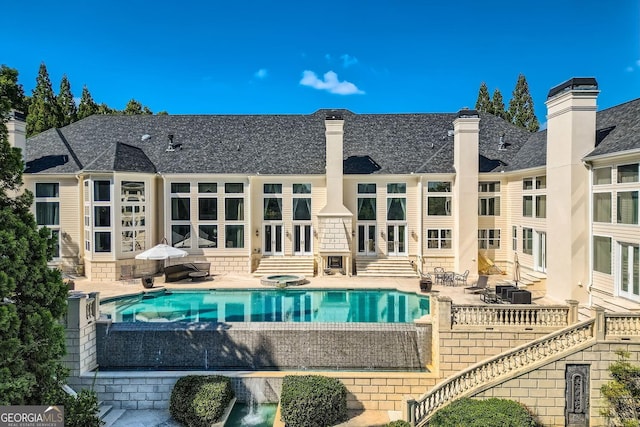 9620 Cedar Grove Rd, Fairburn, GA 30213 - swimming pool with french doors, entry steps, a patio, and an in-ground hot tub
