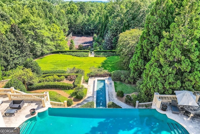 9620 Cedar Grove Rd, Fairburn, GA 30213 - view of pool with an infinity pool, a forest view, and a wooden deck