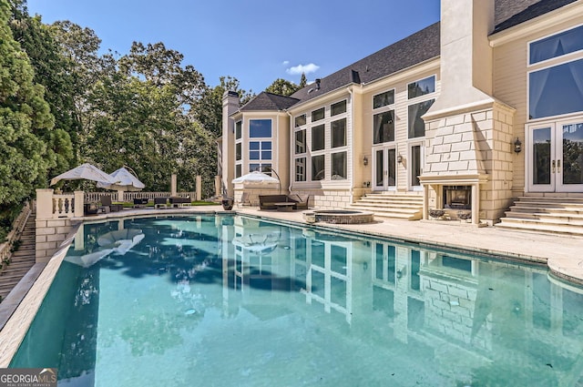9620 Cedar Grove Rd, Fairburn, GA 30213 - view of pool with french doors, a pool with connected hot tub, a patio area, and entry steps
