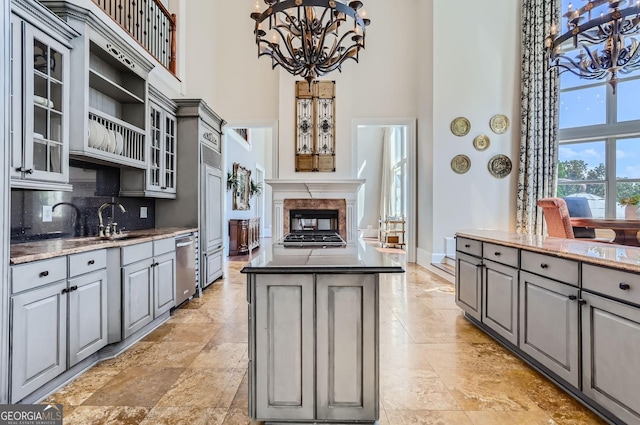 9620 Cedar Grove Rd, Fairburn, GA 30213 - kitchen with gray cabinets, a high ceiling, a chandelier, and a sink