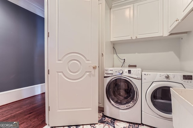 9620 Cedar Grove Rd, Fairburn, GA 30213 - washroom with washer and clothes dryer, cabinet space, baseboards, wood finished floors, and crown molding