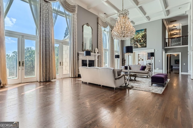 9620 Cedar Grove Rd, Fairburn, GA 30213 - living room with a high ceiling, a chandelier, coffered ceiling, healthy amount of natural light, and beam ceiling