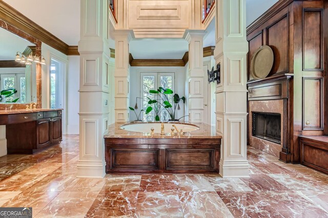 9620 Cedar Grove Rd, Fairburn, GA 30213 - full bath with marble tiled floors, decorative columns, vanity, crown molding, and a premium fireplace