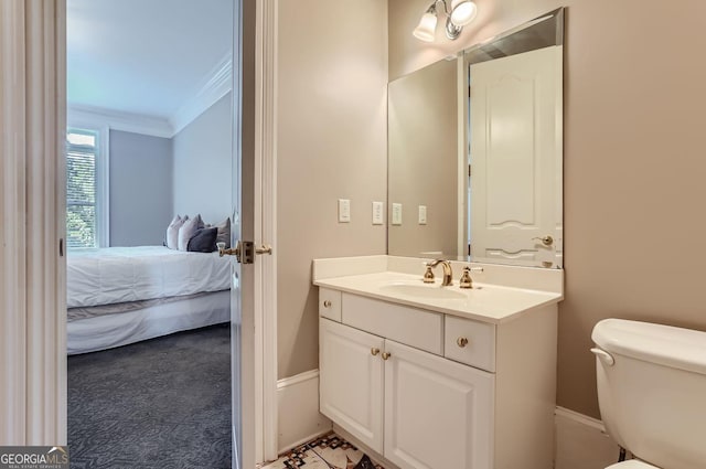 9620 Cedar Grove Rd, Fairburn, GA 30213 - half bath featuring vanity, toilet, ornamental molding, connected bathroom, and baseboards