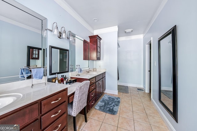 bathroom with vanity, crown molding, and tile patterned flooring