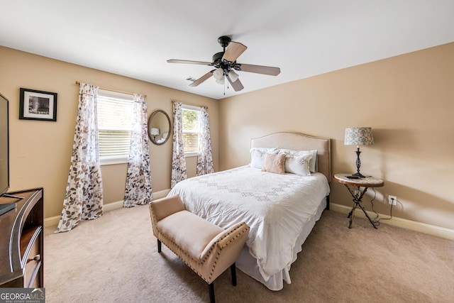 bedroom featuring ceiling fan and light carpet