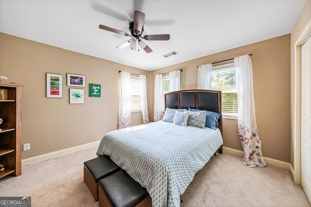 bedroom featuring ceiling fan and light colored carpet